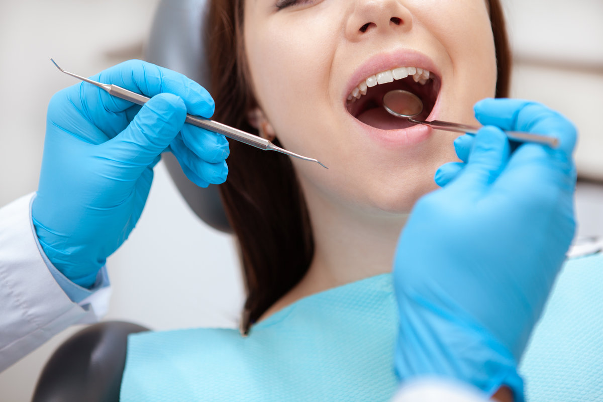 Patient receiving a routine dental cleaning at JAX Dental Studio in Jacksonville, FL